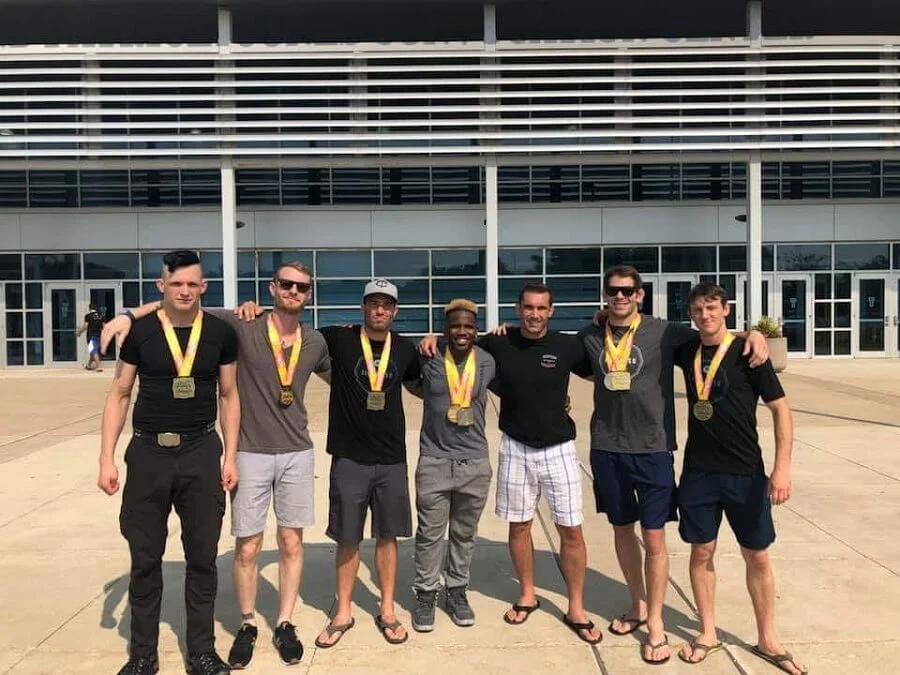 bjj tournament medalists with coach professor mauricio carra